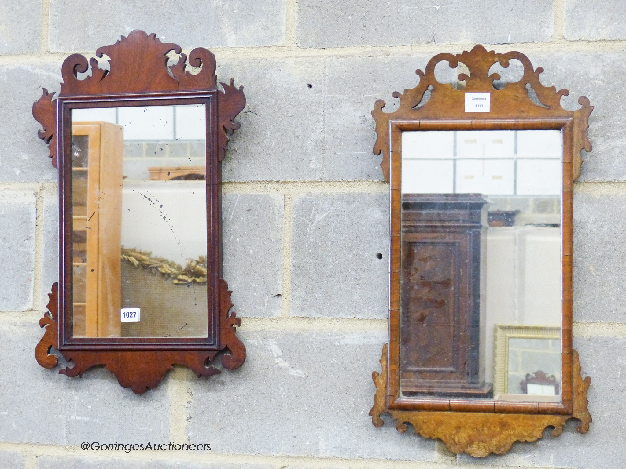 Two George III style walnut fret cut wall mirrors, largest W.37cm. H.67cm